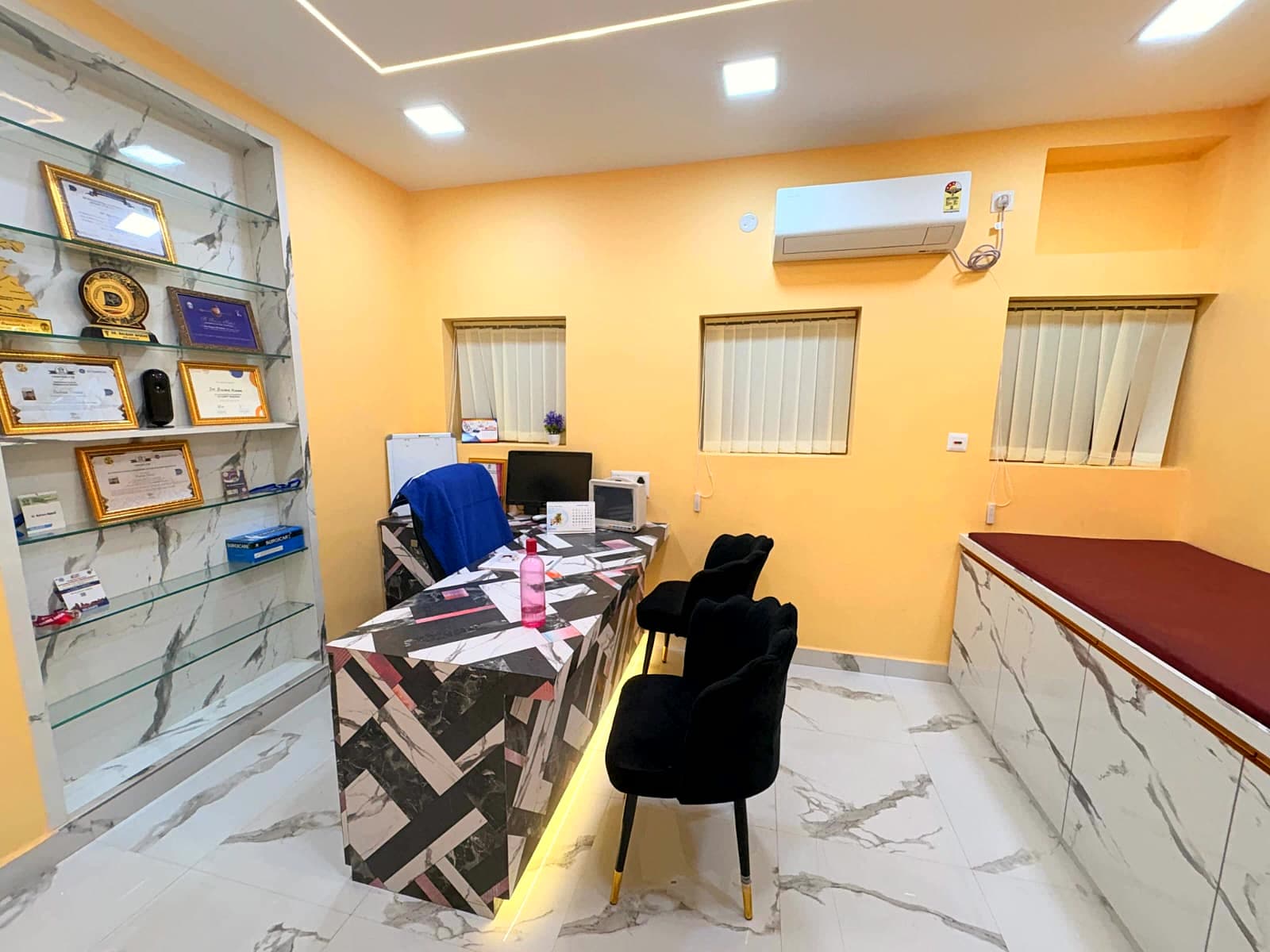 Doctor's cabin at Revivee Clinics with certificates and awards on display
